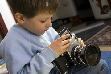 Wall Mural - Young boy with camera