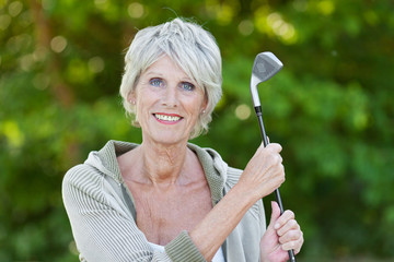 Poster - ältere dame mit golfschläger