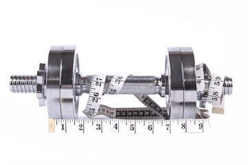 pair of weights with measuring tape on white background