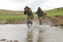 Soldiers Running Across The Water