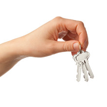 Hand Holding Bunch Of Keys