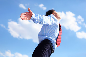 young business man in a blue shirt and red tie