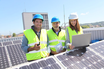 Group of engineers meeting on building roof