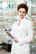© Kadmy - Pharmacy chemist woman in drugstore