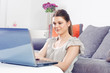 © mitarart - woman using laptop at home