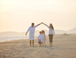 © .shock - happy young family have fun on beach at sunset