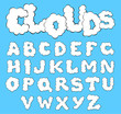 Vector white clouds alphabet on a blue sky background