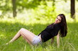 © Xalanx - Young woman sitting in grass