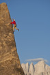 © Greg Epperson - Rock climber rappelling.
