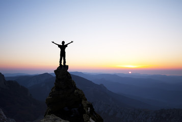 man on the top of the rock