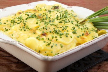 Wall Mural - Scalloped potatoes in square ceramic dish