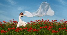 Beauty Woman In Poppy Field With Tissue
