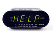 Digital alarm clock with the word HELP