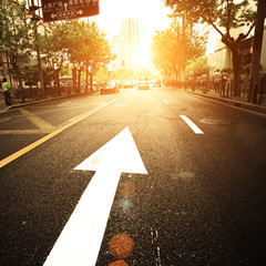 Wall Mural - road in city with sunset