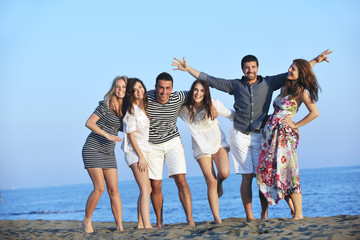 Wall Mural - happy young  people group have fun on beach