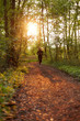 © Christian Schwier - Junge Frau beim Joggen im Wald