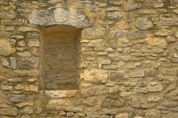 old stone wall witn a niche