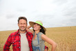 © goodluz - Portrait of happy couple in wheat field