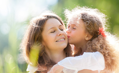 daugher kissing her mother