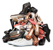 Pile of various female and male shoes over white