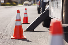 Orange Hazard Safety Cones And Work Truck