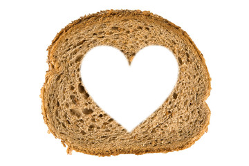 Heart shaped hole in a slice of bread