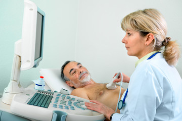 Wall Mural - Senior patient getting ultrasound from doctor