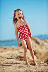 Canvas Print - Child at beach in summer