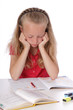 © mariesacha - fillette blonde de 9 ans faisant ses devoirs, ennuyée