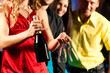 © Kzenon - People with drinks in bar or club