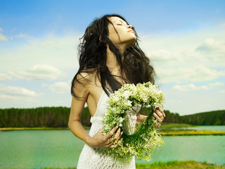 Poster - Beautiful girl wearing a wreath of wildflowers