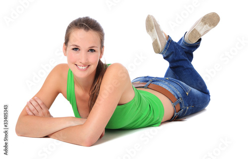 Attraktive junge Frau liegt auf dem Bauch – Stock-Foto | Adobe Stock