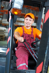 warehouse worker driver in forklift