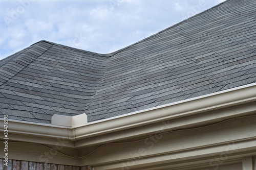 Fotografie, Obraz Rain Gutters Splash Guard on Roof against blue sky