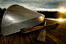 Row Boat At Sunset On A Dock