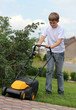 © Denizo - Teen boy  mows the lawn mower electric