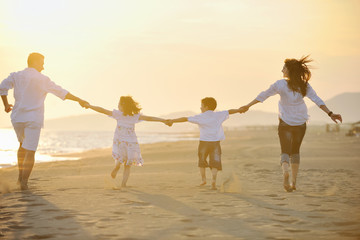 happy young family have fun on beach