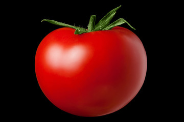 Red tomato on a black background