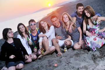 Wall Mural - Group of young people enjoy summer  party at the beach