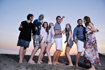 Poster - Group of young people enjoy summer  party at the beach