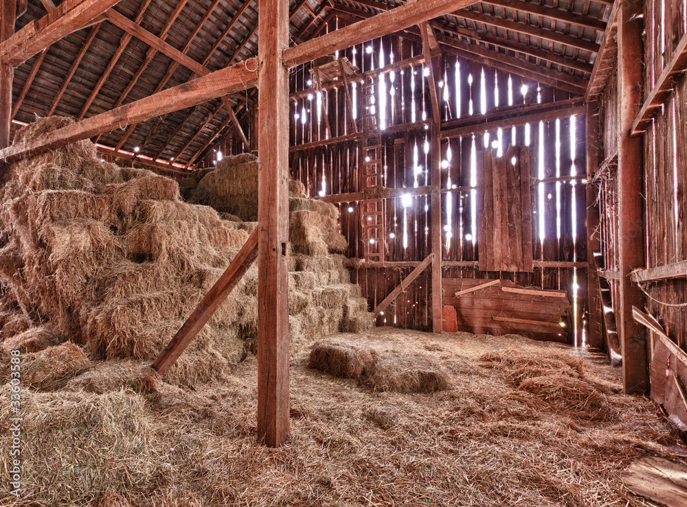 Interior of old barn with straw bales - obrazy, fototapety, plakaty 