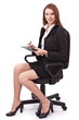 © volff - Portrait of young woman sitting on a chair and writiing smth. on