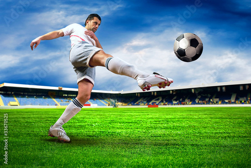 Naklejka na szybę Happiness football player after goal on the field of stadium wit