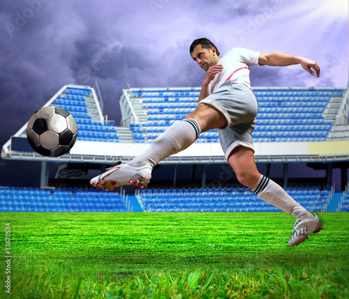 Naklejka na kafelki Happiness football player after goal on the field of stadium und