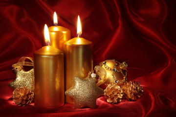 Wall Mural - Christmas candles on a red background