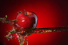 Red Apple In Juice Stream