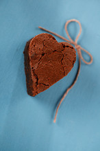 Chocolate  Brownie Dessert In Heart Shape On Blue Wooden Table