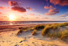 Seaside With Sand Dunes At Sunset
