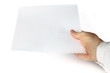a hand showing white paper