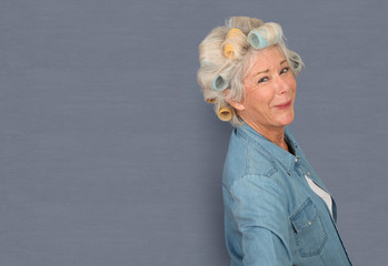 Wall Mural - Portrait of senior woman with hair curlers